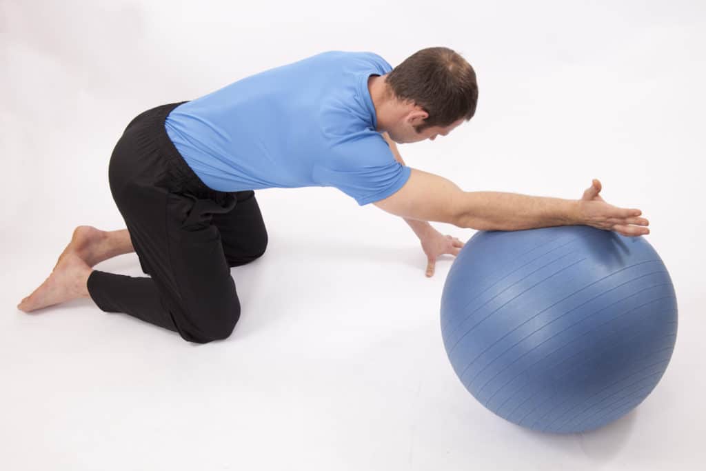 Shoulder stretch on ball for shoulder pain relief